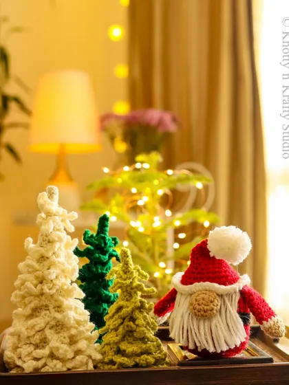 It's time to bring out the Santa Gnome. This little fellow, with his red hat and fluffy beard, is ready to spread some holiday cheer from his spot on the table.