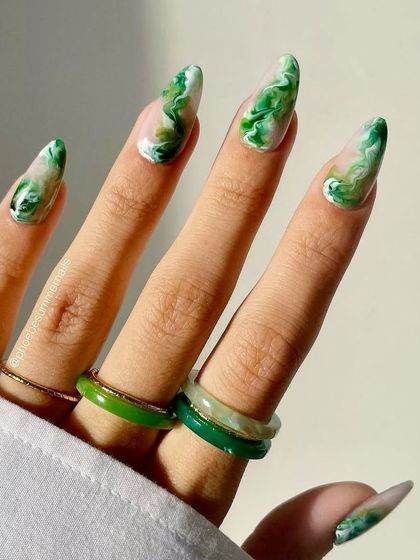 This version of the green quartz design uses a negative space technique, with the marble pattern focused on the tips. It gives the look a lighter, more modern feel while still showcasing the intricate stone effect.