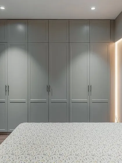Timeless elegance is at the heart of our work. This classic wardrobe, finished in a warm, earthy-toned Italian lacquer with subtle routing patterns, brings a quiet sophistication to the bedroom. The antique finished handles complete the look, creating a piece that feels seamlessly integrated and built to last.