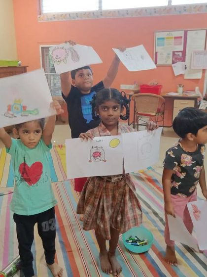 Another proud group shot with their fantastic monster drawings.