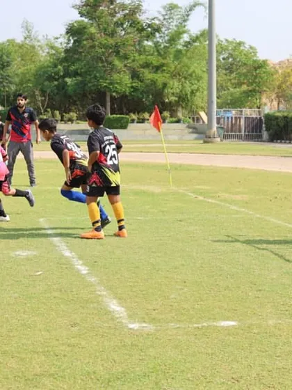 A scramble in front of the goal shows the excitement of our league matches. These moments are where players learn to be decisive and brave.