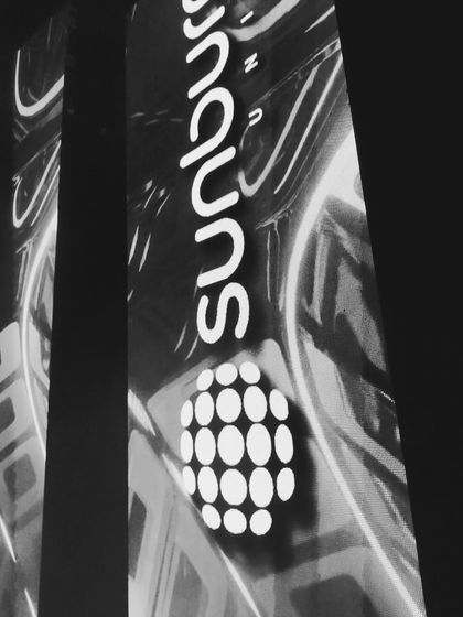 A black and white shot of the Sunburn logo on the big screen. Even without color, the energy and scale of the venue are clear.
