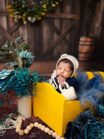 The contrast of the bright yellow crate and the deep blue flowers makes this rustic setup so eye-catching.