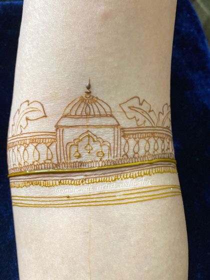 A simple and elegant startup design on the arm, featuring a temple motif. This is a great exercise for practicing clean lines.