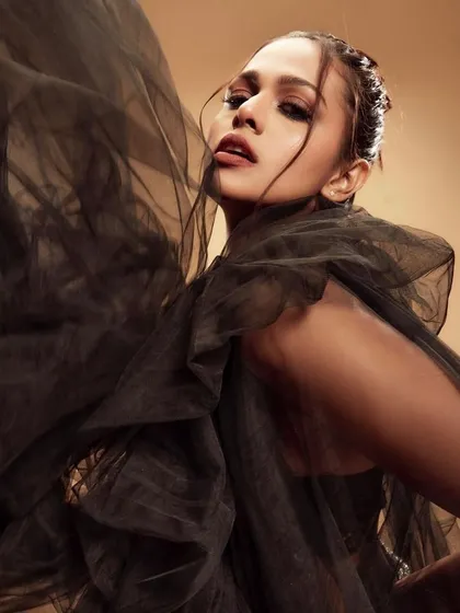An editorial beauty shot with a focus on mood and texture. I created a soft smokey eye and a neutral lip to complement the ethereal feel of the sheer black tulle, ensuring the model's expression remained the focal point.