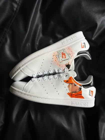 A top-down view of the Lando Norris custom sneakers, showing the artwork on both shoes.