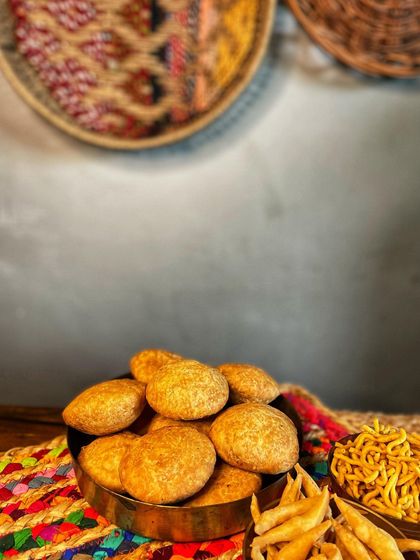 A bowl of our crispy, homemade Kachoris. These are a perfect tea-time snack, loved for their flaky texture and spicy filling.