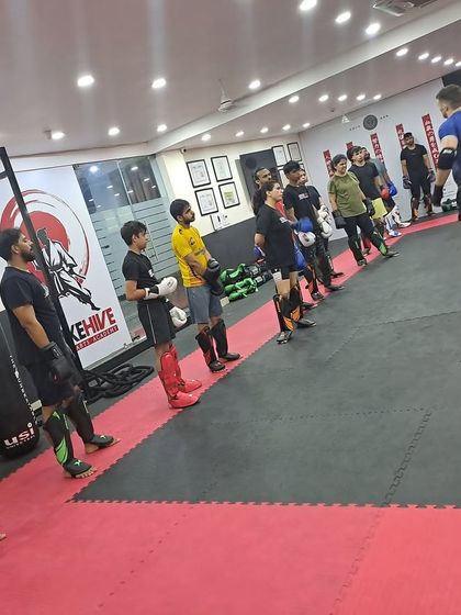 Students line up for instruction during an MMA session filled with knowledge, strength, and fun.