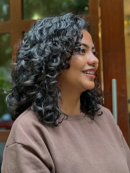 This brave client donated her hair for a great cause. I gave her a stylish and manageable short curly cut that looks amazing and feels liberating.