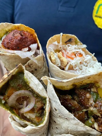 Roll it up for the weekend with my bestseller rolls. This picture shows a variety of my delicious rolls, including paneer and Manchurian fillings.