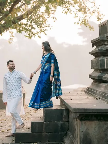 Another beautiful moment on the temple steps. The soft morning light and the ancient tree create a dreamy, romantic atmosphere for this pre-wedding shot.