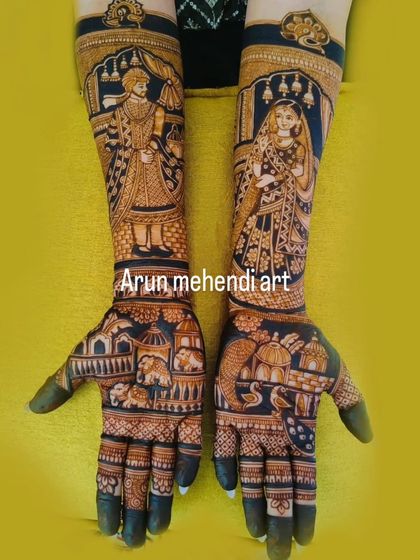 A very grand and intricate design covering the hands and arms completely with portraits and traditional scenes.
