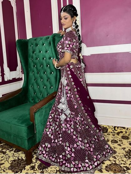 The back view of this lehenga highlights the beautiful design and the playful tassels on the blouse. Every detail is crafted to make you look and feel special.