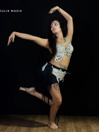 As the founder and lead instructor, I believe dance is an expression of joy. This is a shot from a belly dance performance, showcasing one of the many styles I love to teach and share with my students.