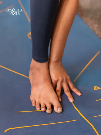 A close up of hands and feet on the mat. Yoga teaches you to connect with your inner divine, and sometimes that starts with the simple act of respecting your own body.