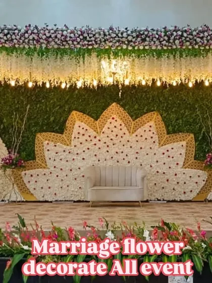 We design and create stunning stage backdrops for weddings and receptions. This setup features a large lotus-shaped panel made of fresh white flowers, creating a beautiful focal point for the main event.