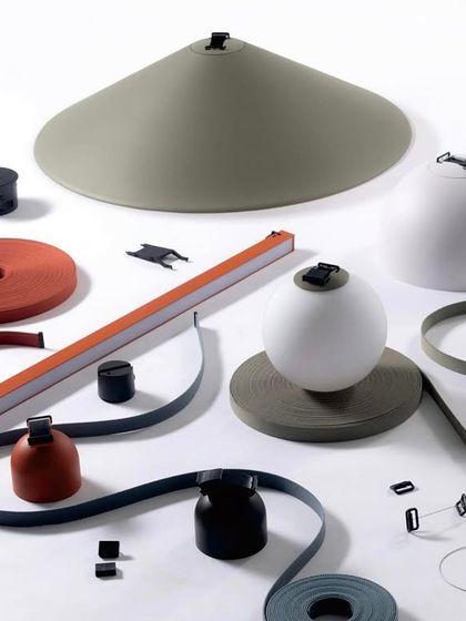 This image displays the full range of components available in our Braided Tape Series. From different colored tapes to various light heads and shades, the system is fully modular, allowing you to design a truly bespoke lighting installation.