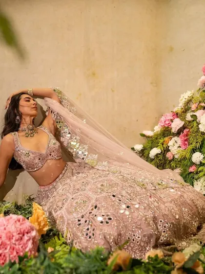 A dreamy, romantic shot where the jewellery and outfit blend seamlessly with the floral surroundings.
