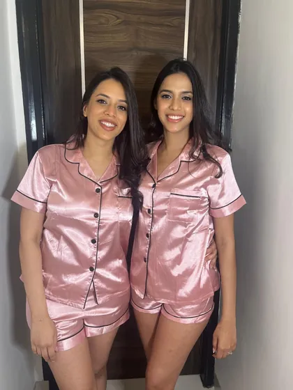 Getting ready together! Two bridesmaids in their matching pajamas, with fresh, natural makeup to start the day.