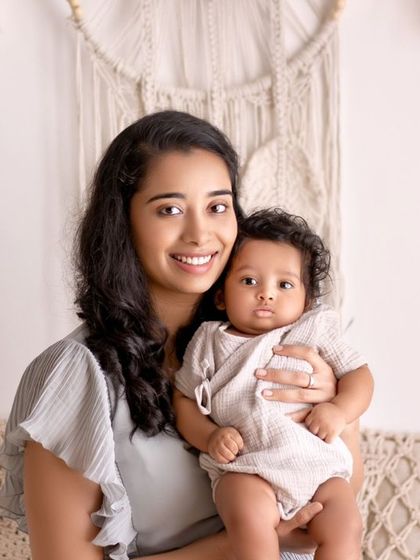 A beautiful portrait of a mother and her baby. The soft colors and gentle expressions create a serene and loving image.