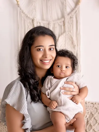 A beautiful portrait of a mother and her baby. The soft colors and gentle expressions create a serene and loving image.