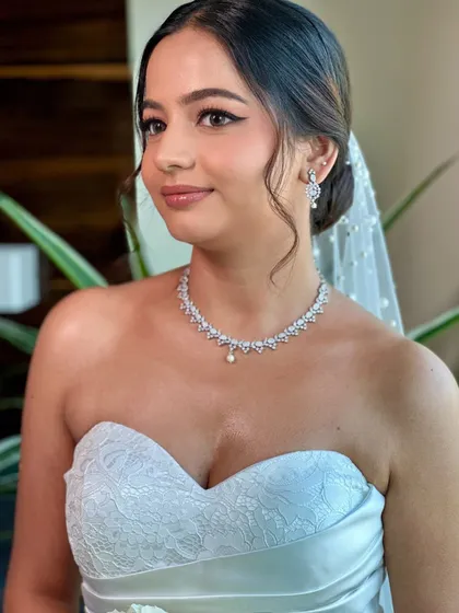The angelic glow of a Christian bride. For Beracah, we created a soft glam look with gentle features and luminous skin, ensuring her natural grace was the highlight of her wedding day look.