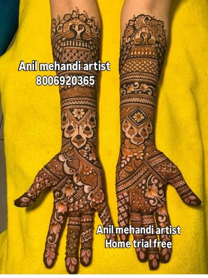 This design showcases a mix of bold floral patterns on the palm and intricate jaal (net) work on the arms. The contrast between the styles makes the design stand out.