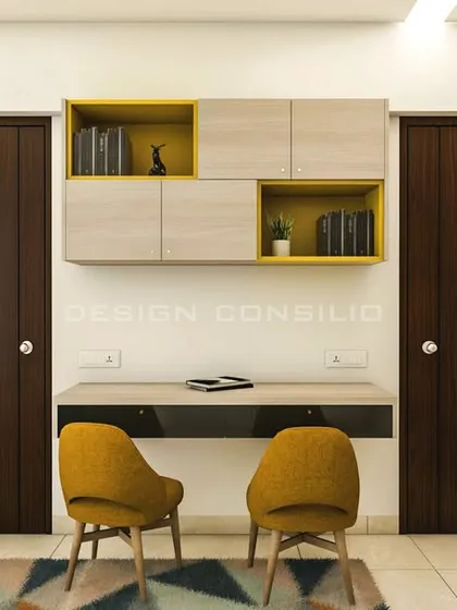 This image shows the shared study area we designed in the kids' bedroom. The dual desks and overhead storage ensure that both children have their own dedicated space for homework and creativity.