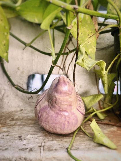 A front view of the pajarito, showing its plump, cheerful shape. It feels wonderful to hold in your hands.