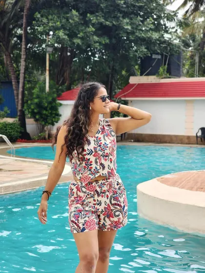 A classic poolside pose, enjoying the sun. This is a staple for any summer or travel-related campaign.