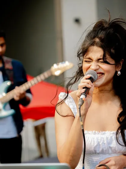 Feeling the music during a live duo performance with my guitarist. This was an incredible moment for me, opening for the band Swarathma at a large outdoor festival.
