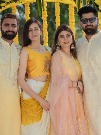 Coordinated looks for a Haldi ceremony. I designed these yellow and cream kurta sets for the groom and his family to create a cohesive and festive group photo.