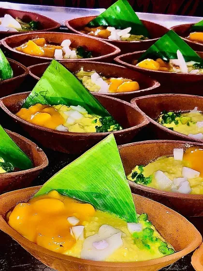 A beautiful display of my mango desserts, each served in an earthen pot and garnished with a banana leaf. This presentation style is both eco-friendly and aesthetically pleasing.