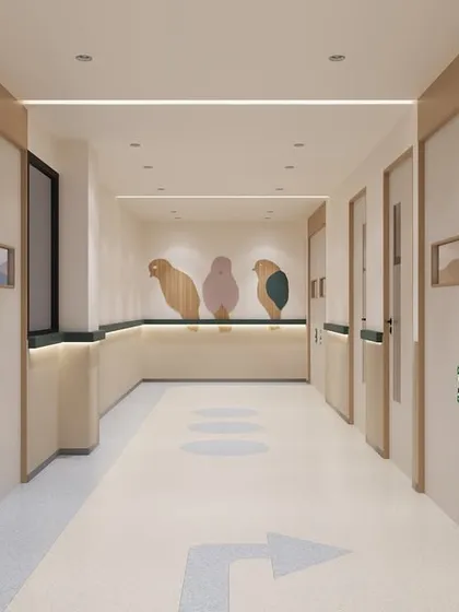 This is a corridor in a pediatric ICU, where we introduced playful, bird-shaped wooden cutouts and soft, rounded corners. These whimsical details help to reduce fear and anxiety for young patients and their families in a high-stress environment.
