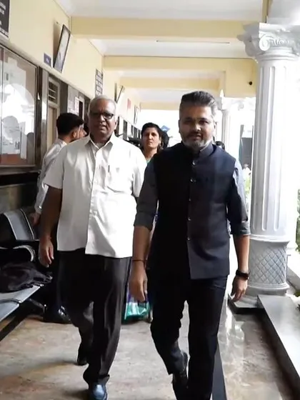 Walking through the college corridors, observing the academic environment.