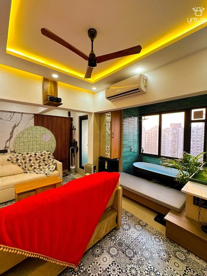 A look inside a luxurious rooftop room, featuring a spa-like bathroom with a standalone tub, seamlessly integrated into the living space.