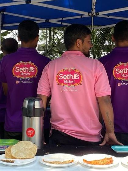 A shot of our team from the back, showing off our Sethji's Kitchen branded t-shirts. We are a team, united in our mission to serve delicious food.