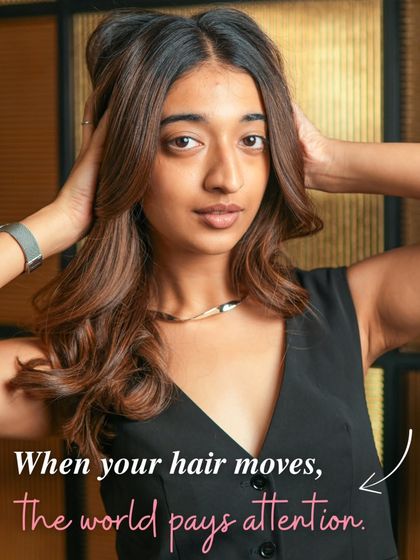 When your hair moves, the world pays attention. This shot captures the beautiful movement and volume of a fresh blowout.