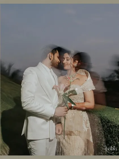 An artistic couple portrait using slow shutter speed to create a dreamy, motion-blur effect, symbolizing the whirlwind of love.