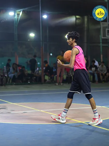 A player looks for an open teammate, demonstrating the court awareness and teamwork we emphasize in our training.