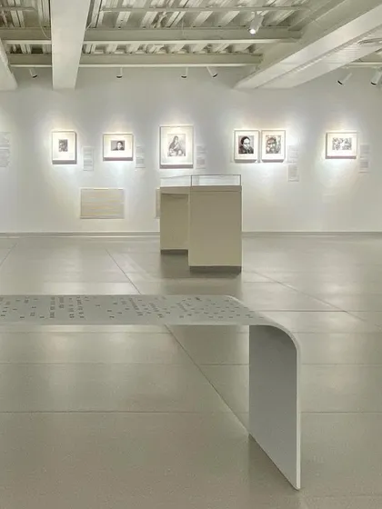 A view of a gallery at the Museum of Art and Photography (MAP), showing the custom-designed benches and clean, open layout. The interior architecture is intended to be understated, keeping the focus on the art collection.