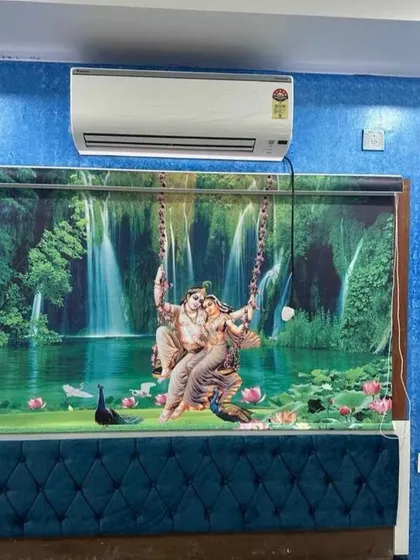 This vibrant 3D printed roller blind shows Radha and Krishna against a lush waterfall backdrop. It's a bold statement piece that brings both artistry and a sense of tranquility to a bedroom.