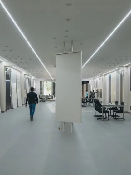 More images from the Krsimar marble showroom, detailing the sliding panel display system and the clean, spacious layout designed for an optimal client experience.