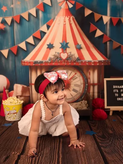 On the move and exploring the carnival. Capturing babies as they crawl and interact with the set results in dynamic and authentic milestone photos.