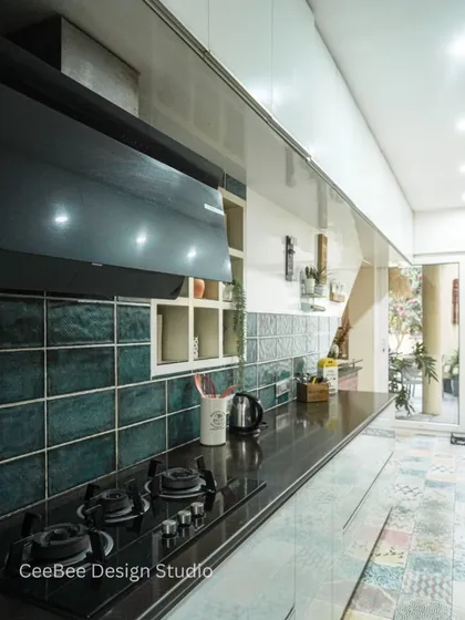A close-up of the cooktop area in the galley kitchen from image 79.