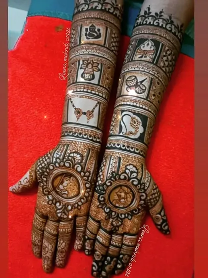 A complete bridal story told on the hands. This design features detailed portraits of the couple, surrounded by traditional wedding symbols like Lord Ganesha, a doli, shehnai, and kalash, making it a true narrative piece.