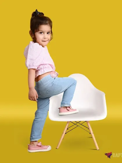 A playful and energetic shot from a kids' fashion session. I use bright, colourful backdrops and encourage natural movement to capture fun and professional images for child models' portfolios or clothing brands.