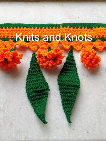 This 3 foot long Zendu toran with alternating orange flowers and green leaves is a popular choice for festive home decor. The length can be customized.