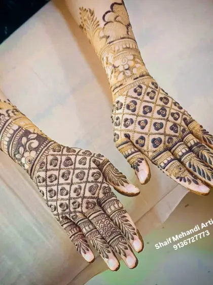 A detailed back-of-hand design featuring a classic jaali (net) pattern filled with tiny flowers. This style is a favorite for its intricate look, complemented by a floral cuff and detailed finger work.