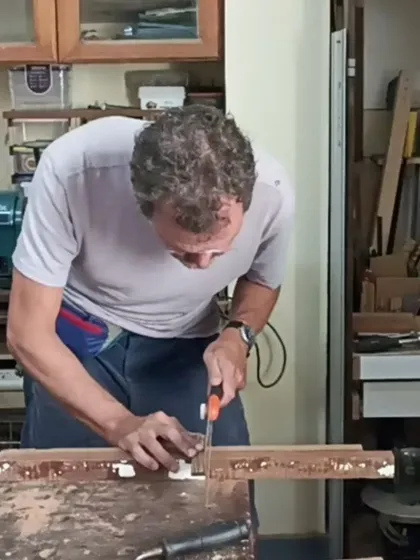 Chris using a Japanese pull saw to make a precise cut. He spent a week in the workshop learning various hand tool techniques.
